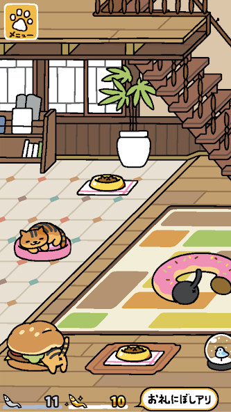 屋内のおうちスペースでくつろぐ猫と家具のゲーム画面